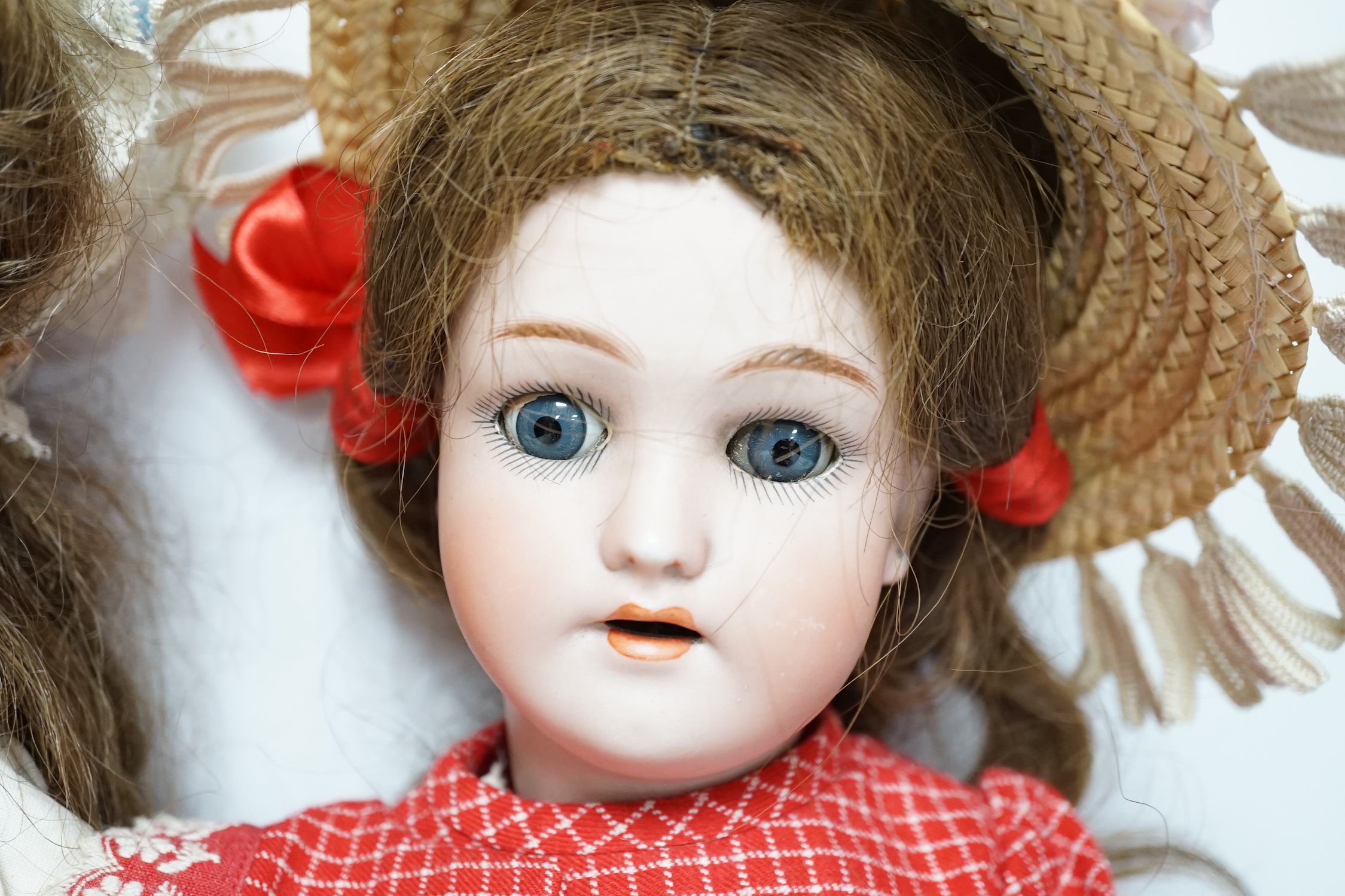 A Gebruder Kuhnlenz K168 doll, 58cm, good condition, and a Heinrich Handwerck Simon & Halbig doll, 45cm